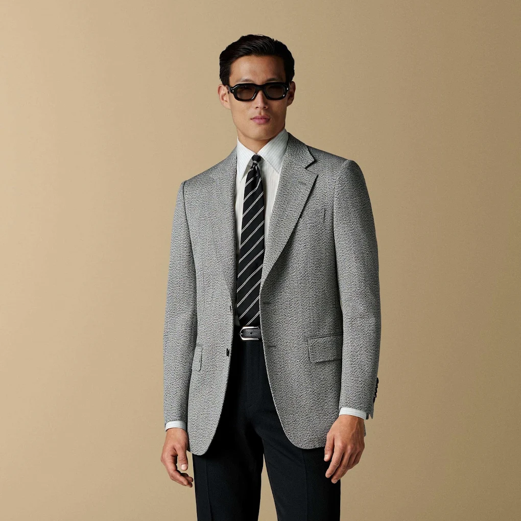 Model wearing a made-to-measure grey jacket
